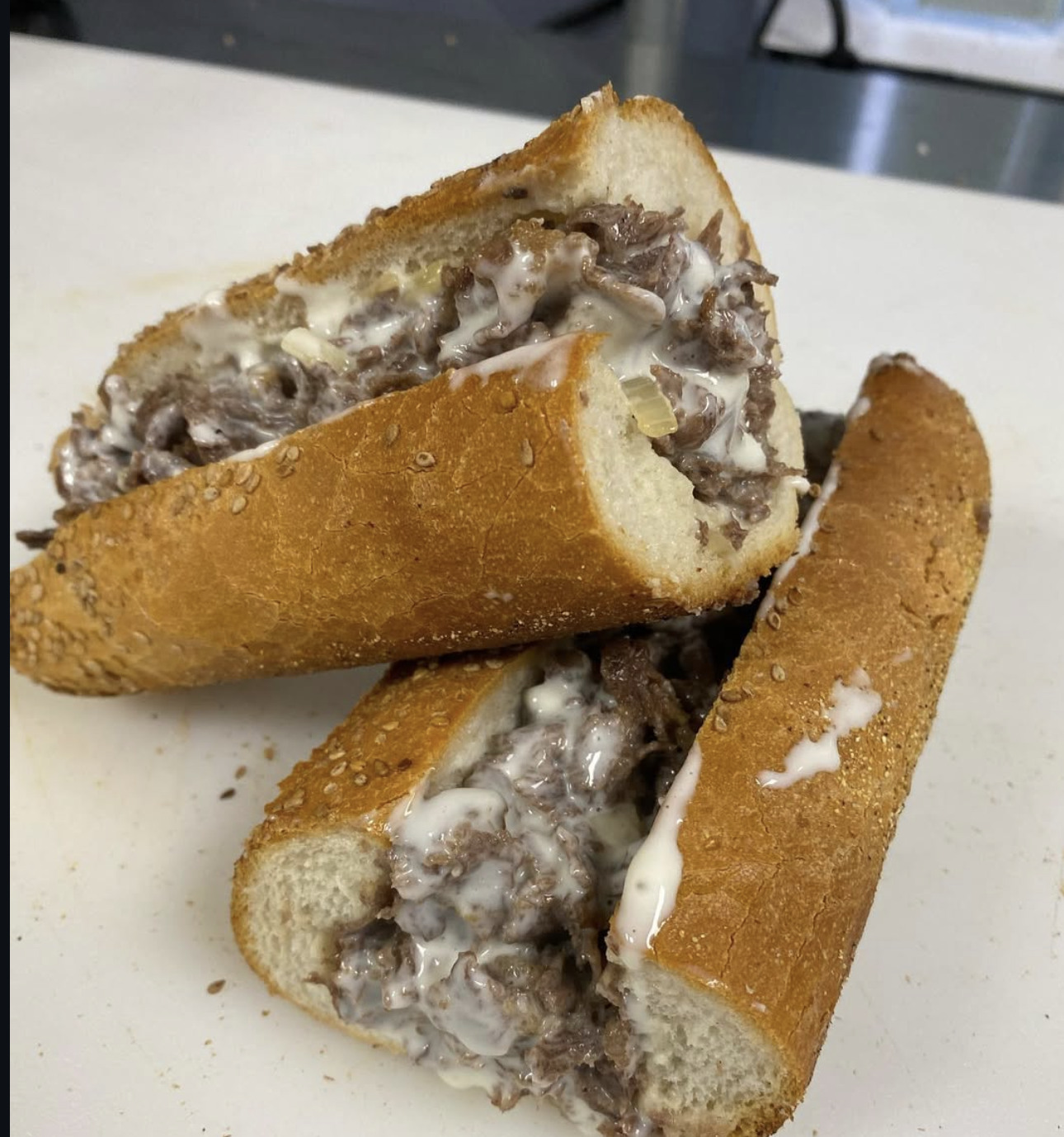 Santini's rib-eye cheesesteaks with melted cheese and onions